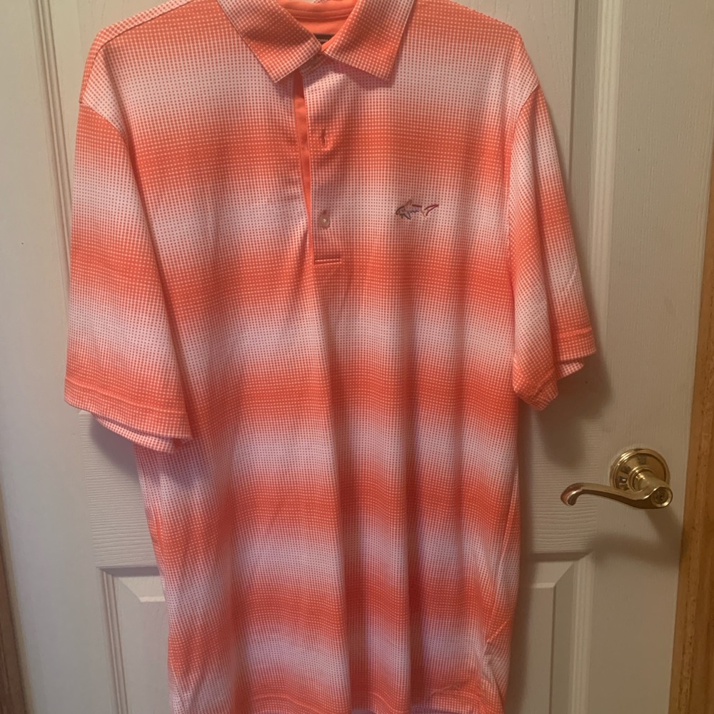 Men’s Greg Norman polo style shirt. Size Medium
